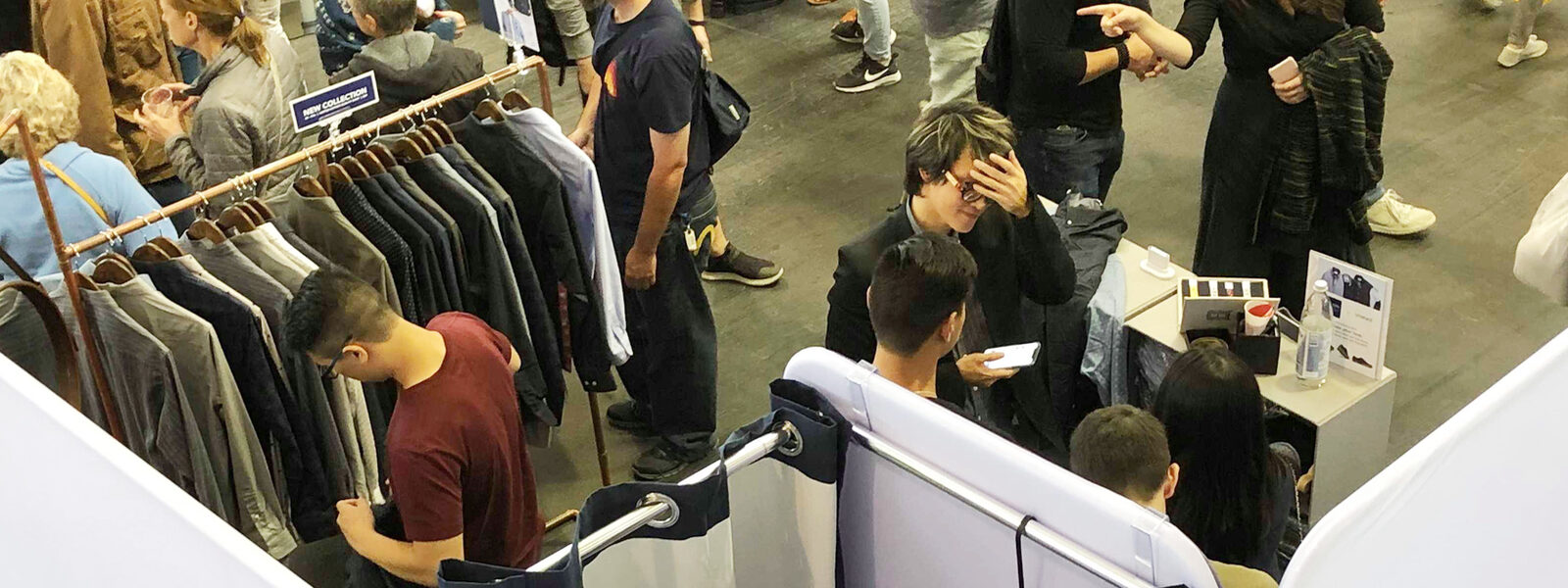 Cotton the First — Customers at pop-up booth, overhead view