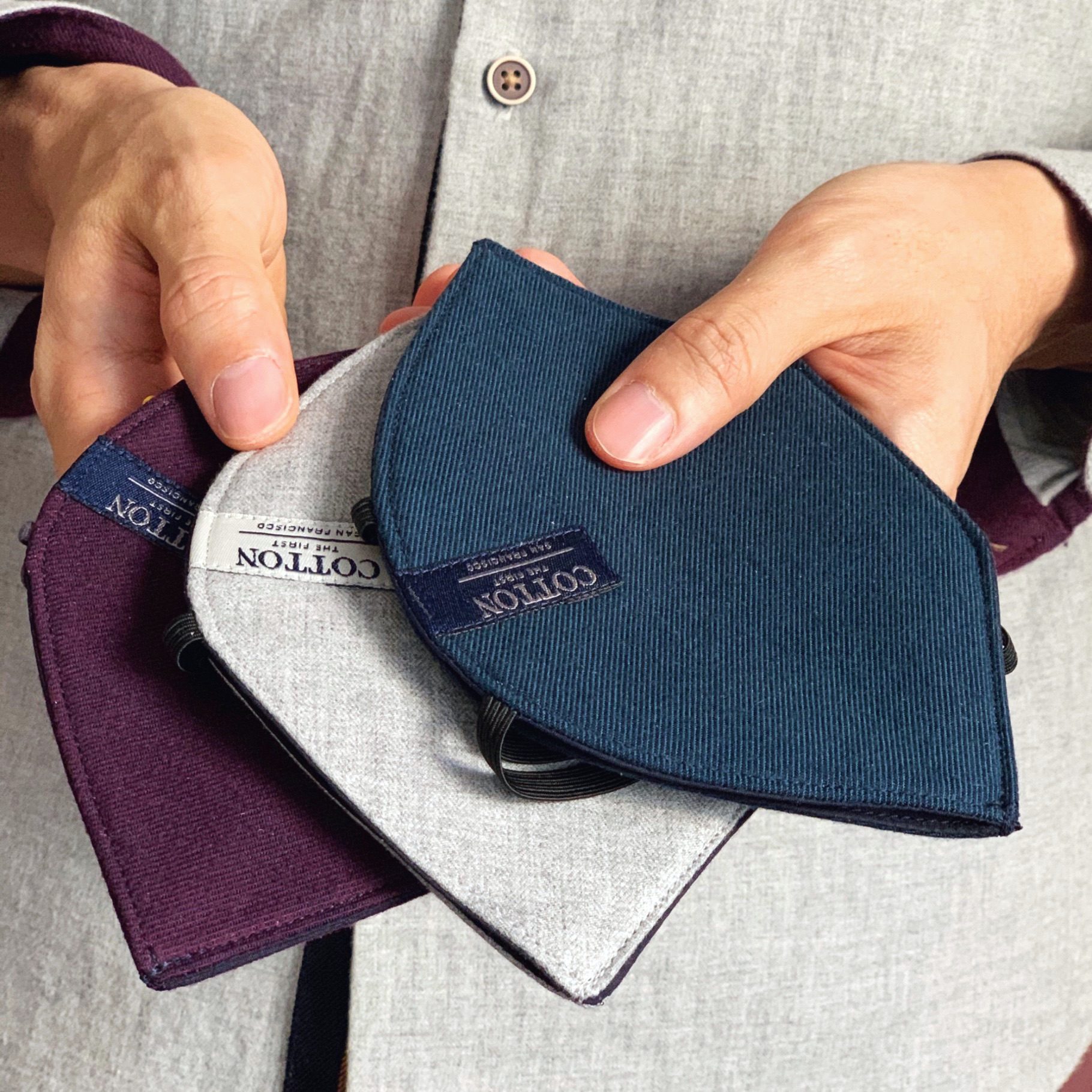 Cotton the First masks held in hand